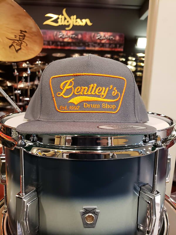 Bentley's Drum Shop Clothback Snapback Hat in Grey w/ Orange Logo